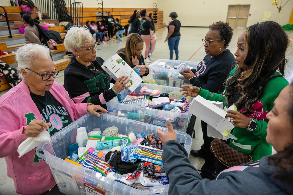 Members of the Alpha Kappa Alpha sorority, including from left, Josea Tyler, Lynne Boyer, Julie Gray, Shellye Oatis, Christina Jenkins, and Audrey Gardner, sorted donations to pack hygiene kits during We Are ONE, Alpha Kappa Alpha Day of Service at Martin Luther King Elementary Jr. School on Monday, Jan. 20, 2025, in Kansas City.