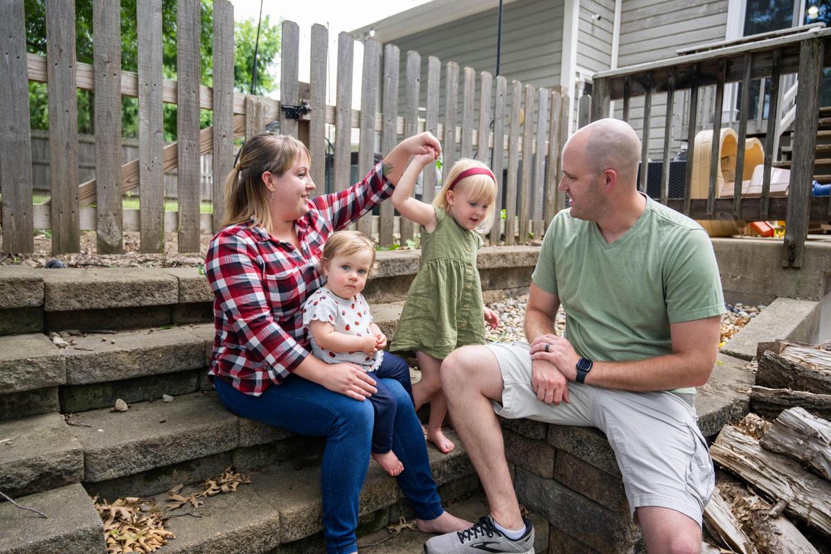 Amanda and Michael Liebig pose with their children Keira, 1, and Emelia, 3.