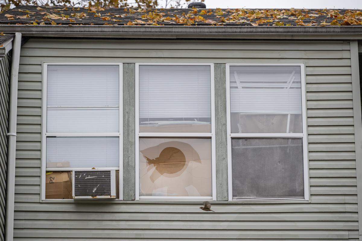A broken window is seen at the Olive Park Village Apartments on Friday, Nov. 21, 2025, in Kansas City.