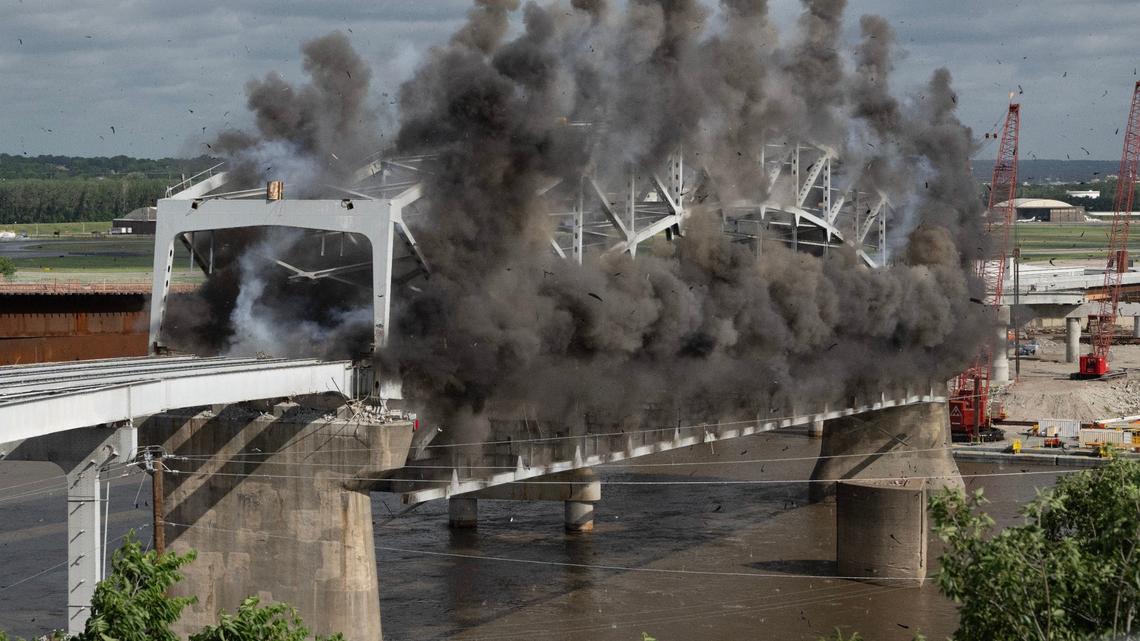 Explosive charges are detonated to take down the final arch of the Buck O’Neil Bridge Tuesday over the Missouri River near downtown Kansas City.