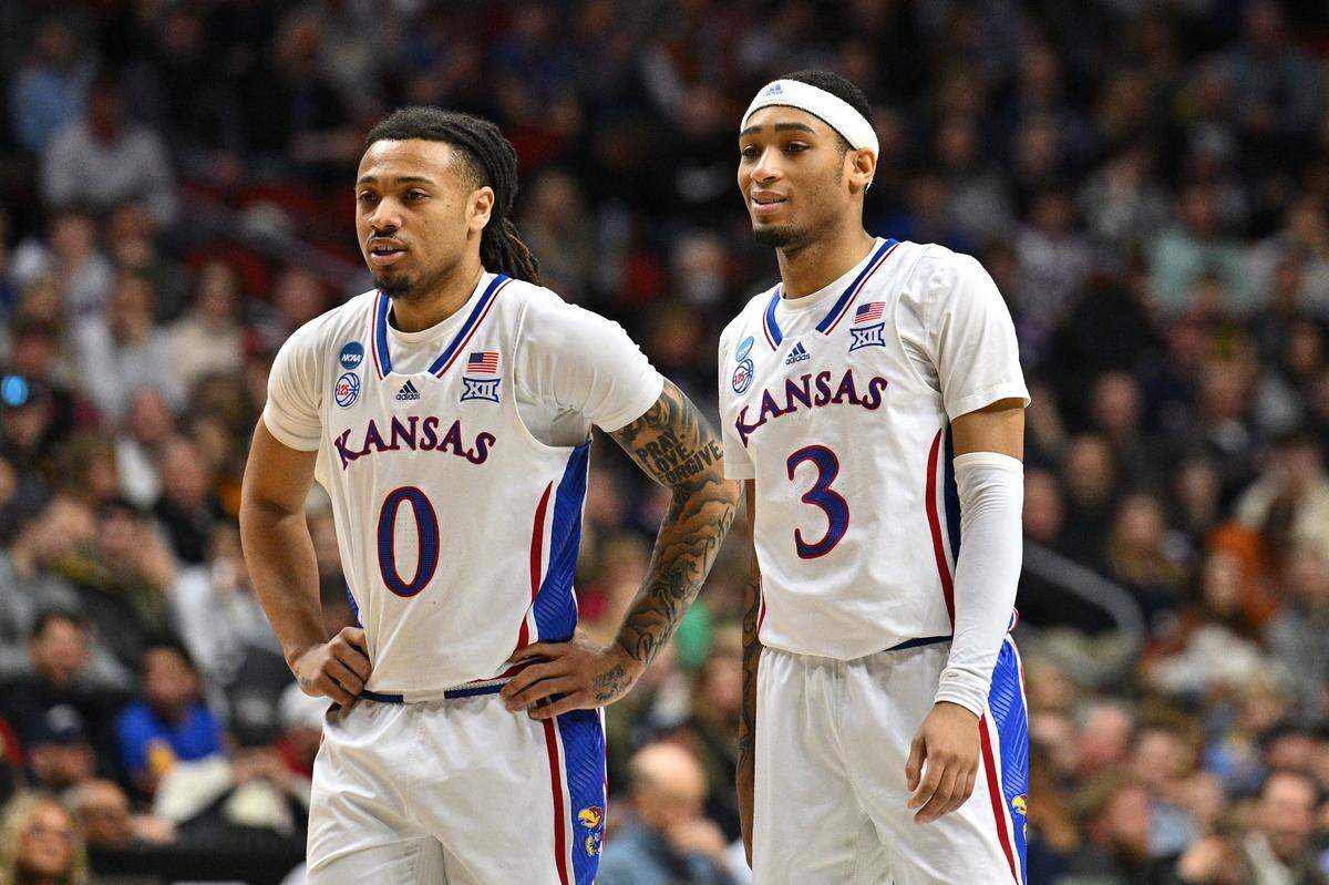 Kansas guards Bobby Pettiford Jr. (0) and Dajuan Harris Jr. (3) look on during the first half against Arkansas at Wells Fargo Arena in Des Moines, Iowa, on March 18, 2023.