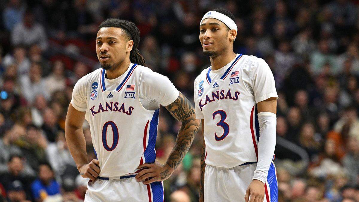 Kansas guards Bobby Pettiford Jr. (0) and Dajuan Harris Jr. (3) look on during the first half against Arkansas at Wells Fargo Arena in Des Moines, Iowa, on March 18, 2023.