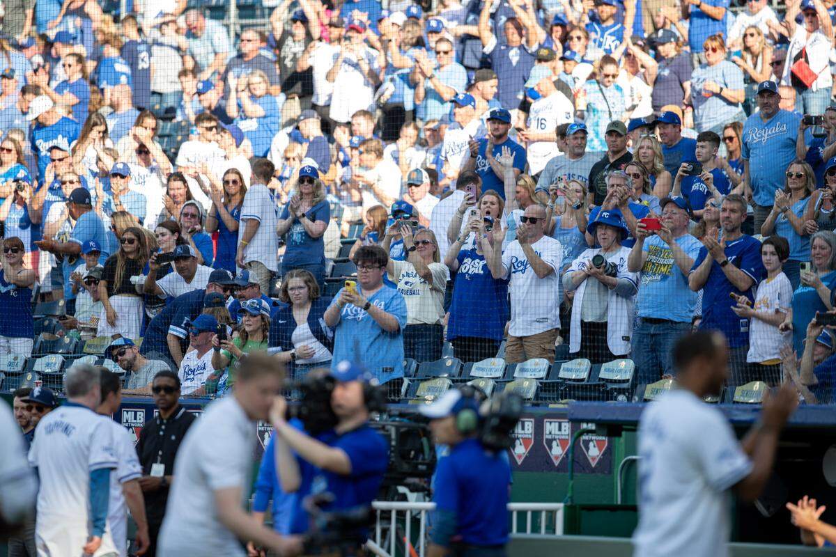 Kansas City Royals fans cheer as members of the 2014 team leave the field following a pre-game ceremony honoring the club’s American League champions at Kauffman Stadium on Friday, May 17, 2024.