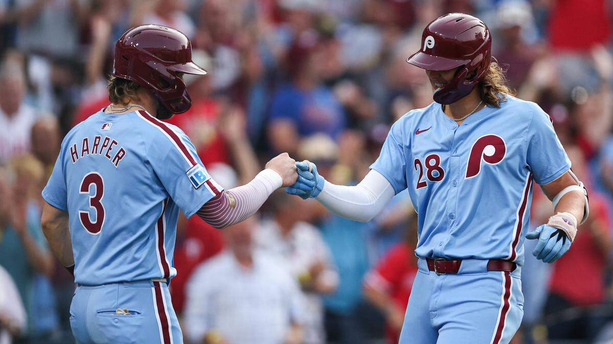 Philadelphia Phillies third base Alec Bohm (28) greeted first base Bryce Harper (3) after hitting a three-run home run against the Washington Nationals at Citizens Bank Park.