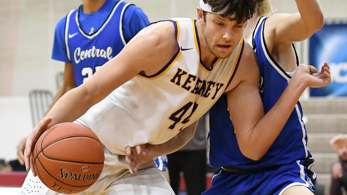 Kearney senior Ashton Holloway pushes to the basket as St. Joseph Central senior Stone Wetlaufer defends in the second half. The Kearney High School Bulldogs defeated the Central High School Indians of St. Joseph 51-38 Tuesday, Dec. 28, 2021, to advance Thursday to the fifth place game in Patterson Division of the William Jewell High School Holiday Classic.