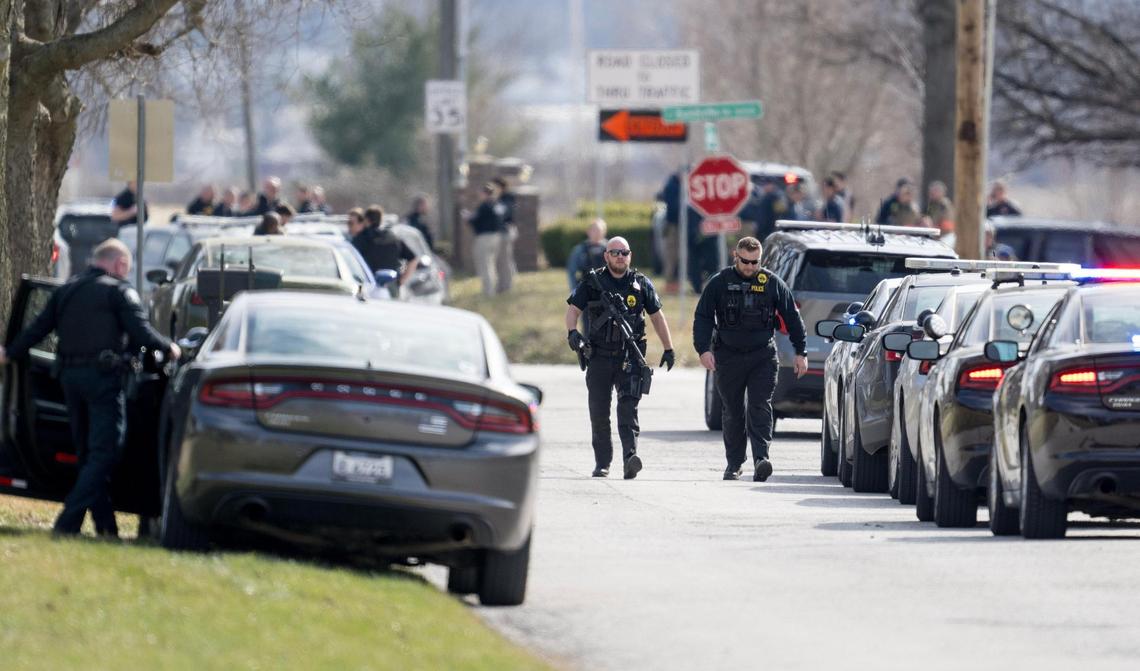 Law enforcement officials and medical personnel work the scene of an officer involved shooting near the intersection of Elsea Smith Road and Bundschu Road on Thursday, Feb. 29, 2024, in Independence.