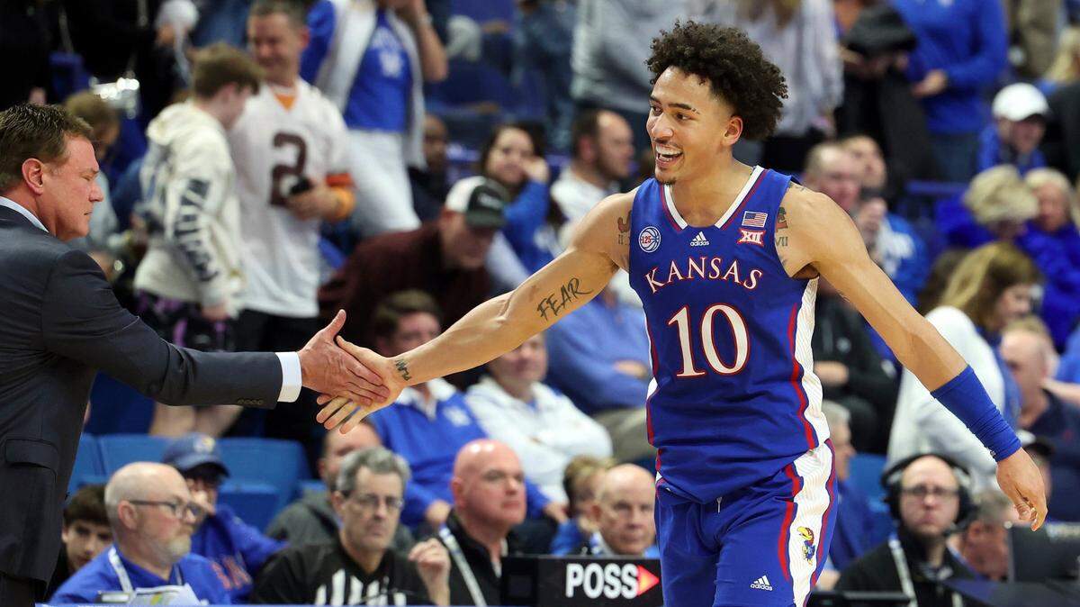 Kansas’ Jalen Wilson is congratulated by coach Bill Self after the team’s game against Kentucky in Lexington on Jan. 28, 2023. Kansas won 77-68.