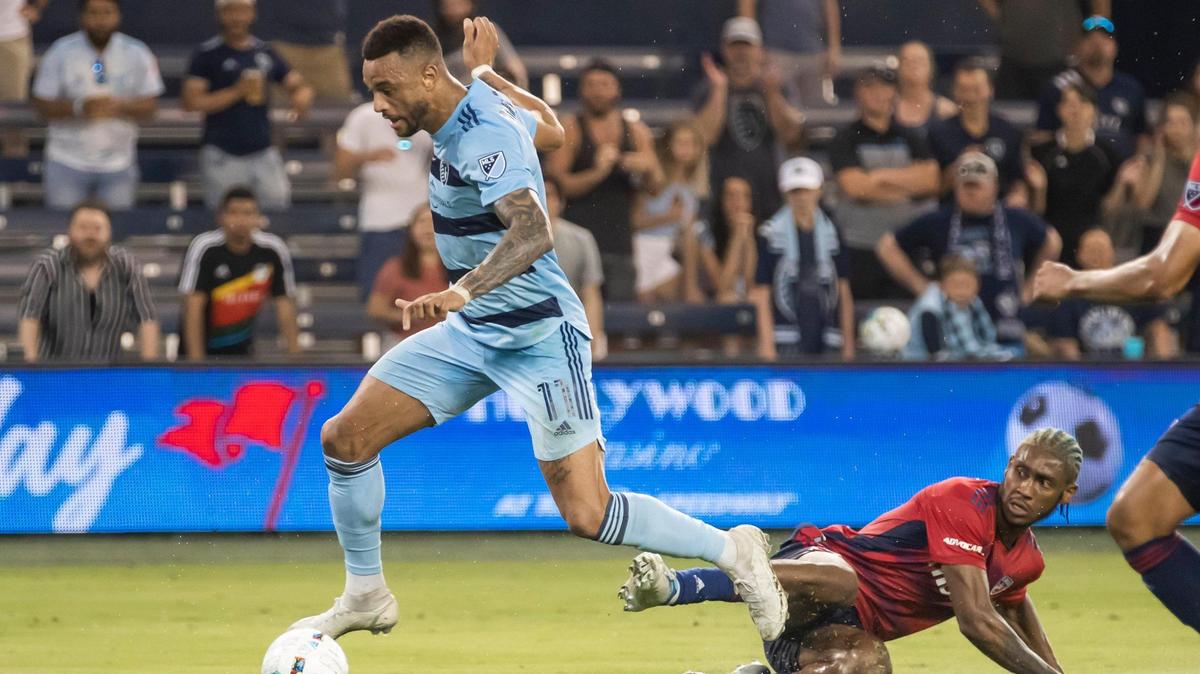 Sporting Kansas City forward Khiry Shelton (11) leaps over a defender to score a goal in extra time during the US Open Cup match against FC Dallas on Tuesday May 10th, 2022 at Children’s Mercy Park in Kansas City, Kansas