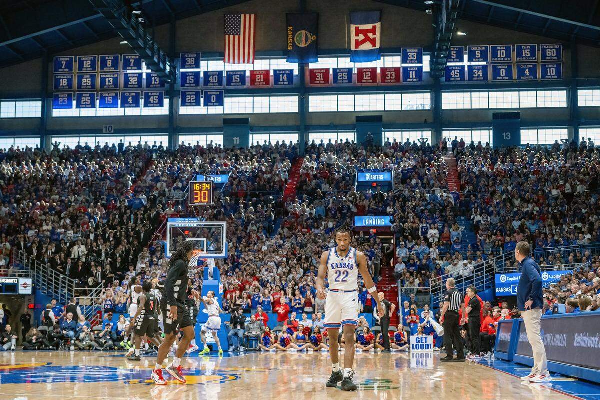 Kansas Jayhawks guard Darryn Peterson (22) walks toward the bench in the game against the Cincinnati Bearcats in the second half Allen Fieldhouse on Saturday, Feb. 21, 2026, in Lawrence, Kansas.