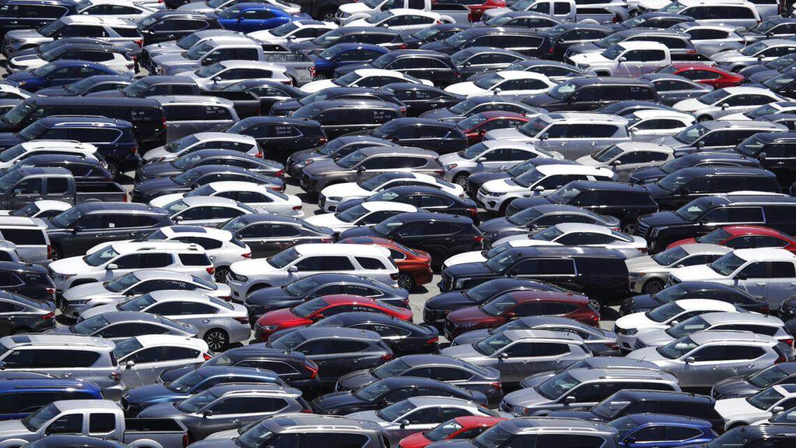 Rental cars are stored on the parking lot of Dodger Stadium amid the coronavirus pandemic, Tuesday, May 26, 2020, in Los Angeles. (AP Photo/Marcio Jose Sanchez)