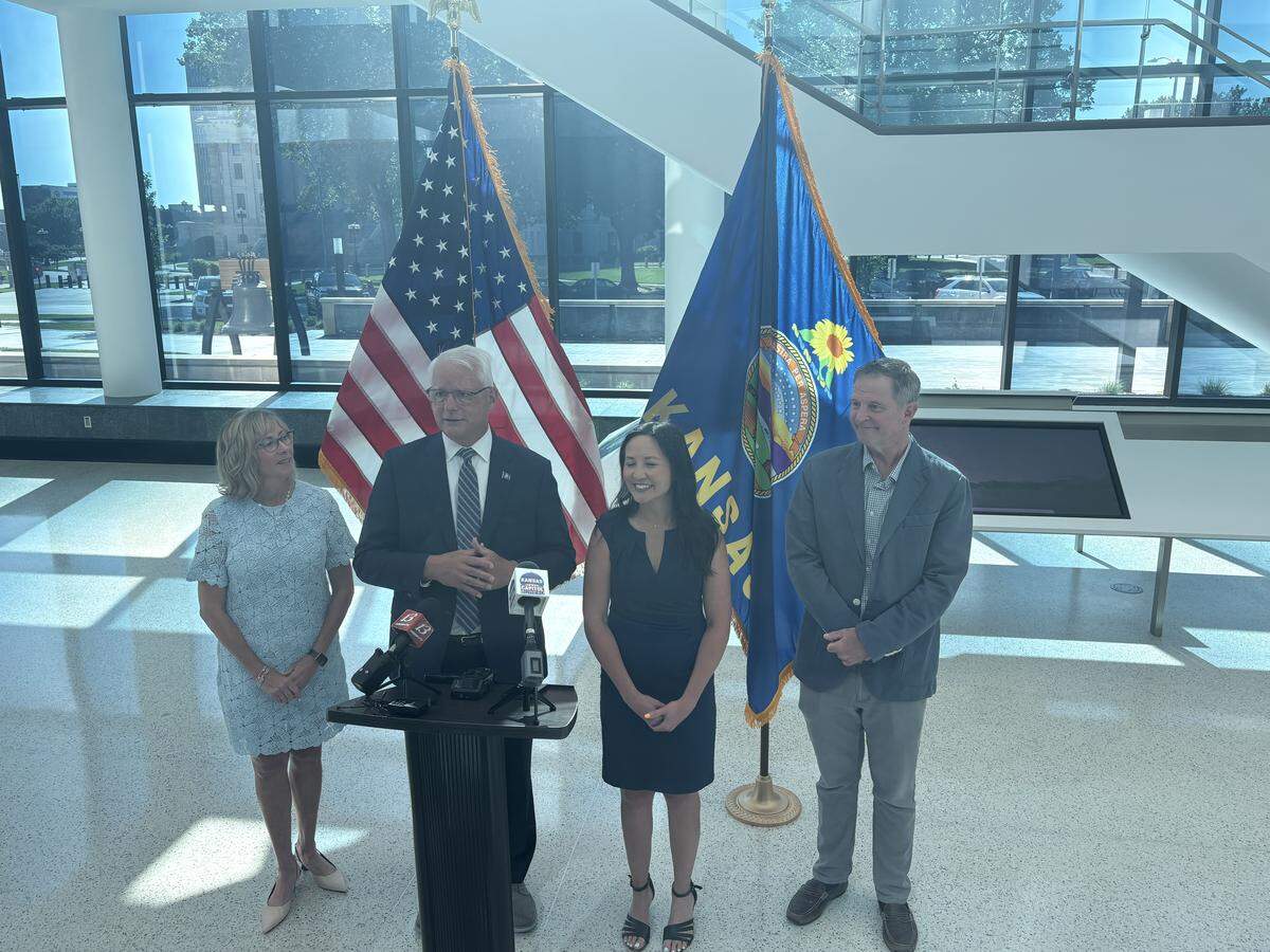 Overland Park Mayor Curt Skoog (second from left) stands with his running mate Jennifer McKenney (second from right) and their partners after filing to run for governor as a Democrat.