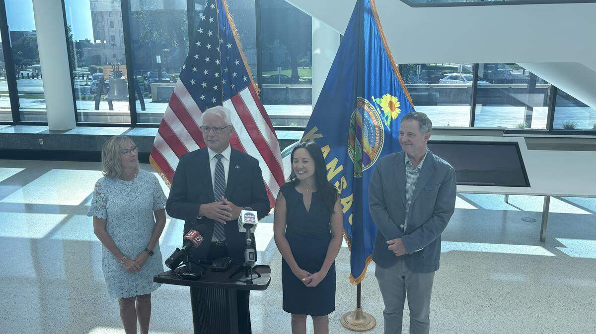 Overland Park Mayor Curt Skoog (second from left) stands with his running mate Jennifer McKenney (second from right) and their partners after filing to run for governor as a Democrat.