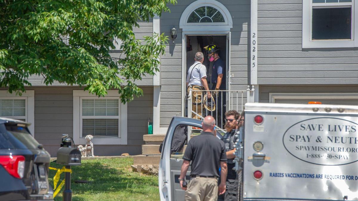 Animal services pick up the remains of a dog after first responders were called to a fatal fire that killed a man and a dog in Independence on Thursday, June 30, 2022.