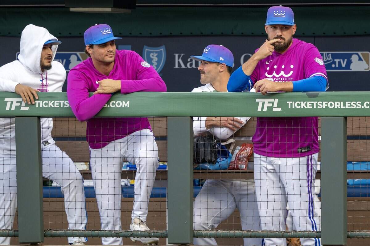 Kansas City Royals players are pictured in the dugout wearing the team's new "Forever Fountains" City Connect uniforms before a game against the Houston Astros on Friday, June 12, 2026, at Kauffman Stadium in Kansas City.