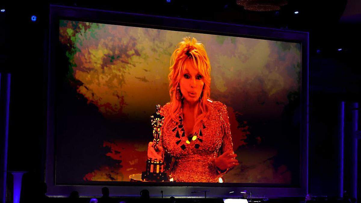 HOLLYWOOD, CALIFORNIA - NOVEMBER 16: Dolly Parton accepts an Academy Honorary Award via video during the 16th Governors Awards at The Ray Dolby Ballroom on November 16, 2025 in Hollywood, California. (Photo by Kevin Winter/Getty Images)