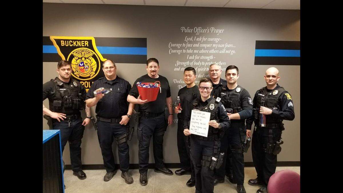 Jonah Oswald (second from the right) is photographed with officers at the Buckner Police Department after Oswald joined the force in 2018.
