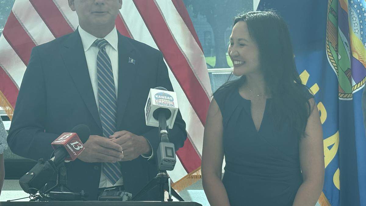 Overland Park Mayor and Democratic candidate for governor Curt Skoog stands next to his lieutenant governor pick, Jennifer McKenney, on June 1 after filing hours before the deadline.