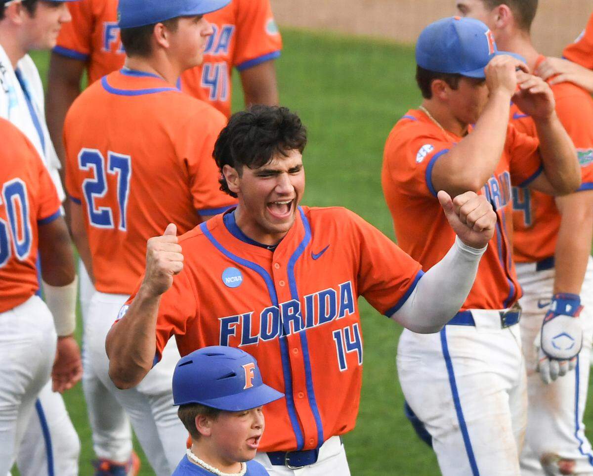 Florida Gators junior Jack Caglianone celebrates with his team after their win in the bottom of the 13th inning against Clemson in the 2024 NCAA Super Regionals.