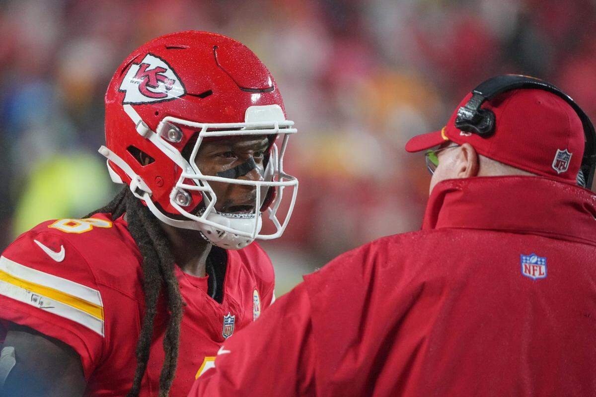Kansas City Chiefs wide receiver DeAndre Hopkins talked with head coach Andy Reid during a game against the Tampa Bay Buccaneers at GEHA Field at Arrowhead Stadium.