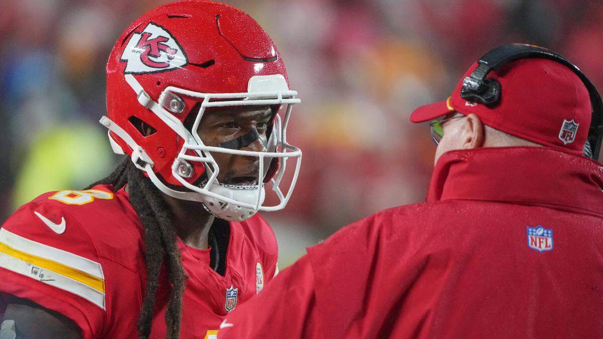 Kansas City Chiefs wide receiver DeAndre Hopkins talked with head coach Andy Reid during a game against the Tampa Bay Buccaneers at GEHA Field at Arrowhead Stadium.