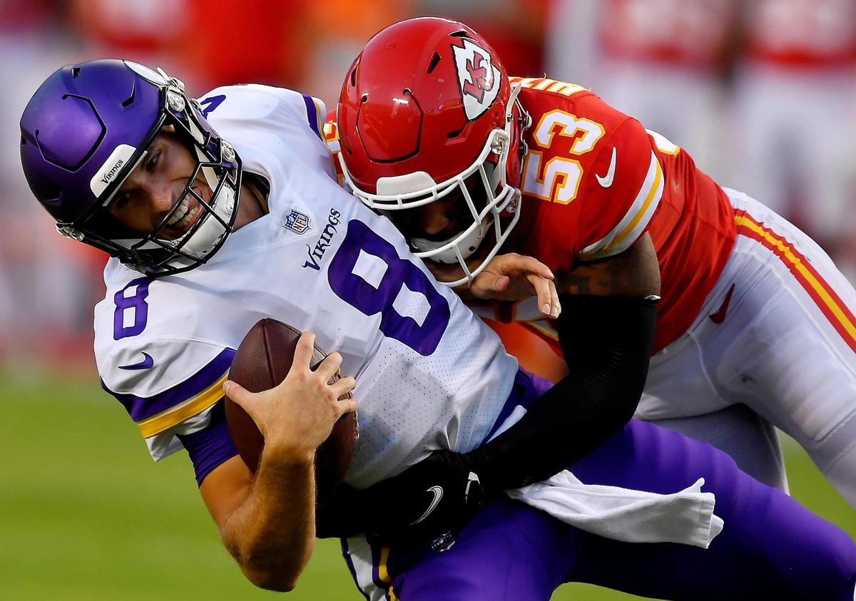 Chiefs line backer Anthony Hitchens crushes Misnnesota quarterback Kirk Cousins for a sack during the first half of Friday night’s preseason game at Arrowhead Stadium.