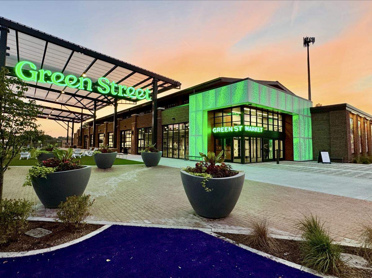 The Green Street Farmers Market will open April 4 for its first full season. The front of the pavilion is illuminated in green light.