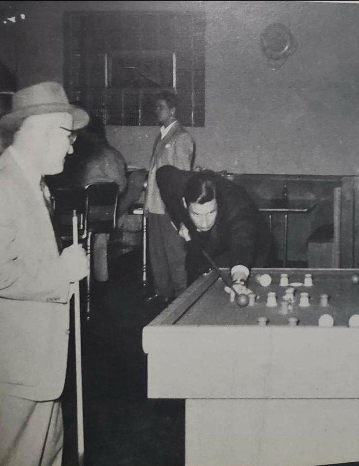 In 1955, club member Joe Zugecic brought Will Rogers Jr. to the St. John Catholic Club to shoot pool. Nick Tomasic Sr. can be seen in the background.