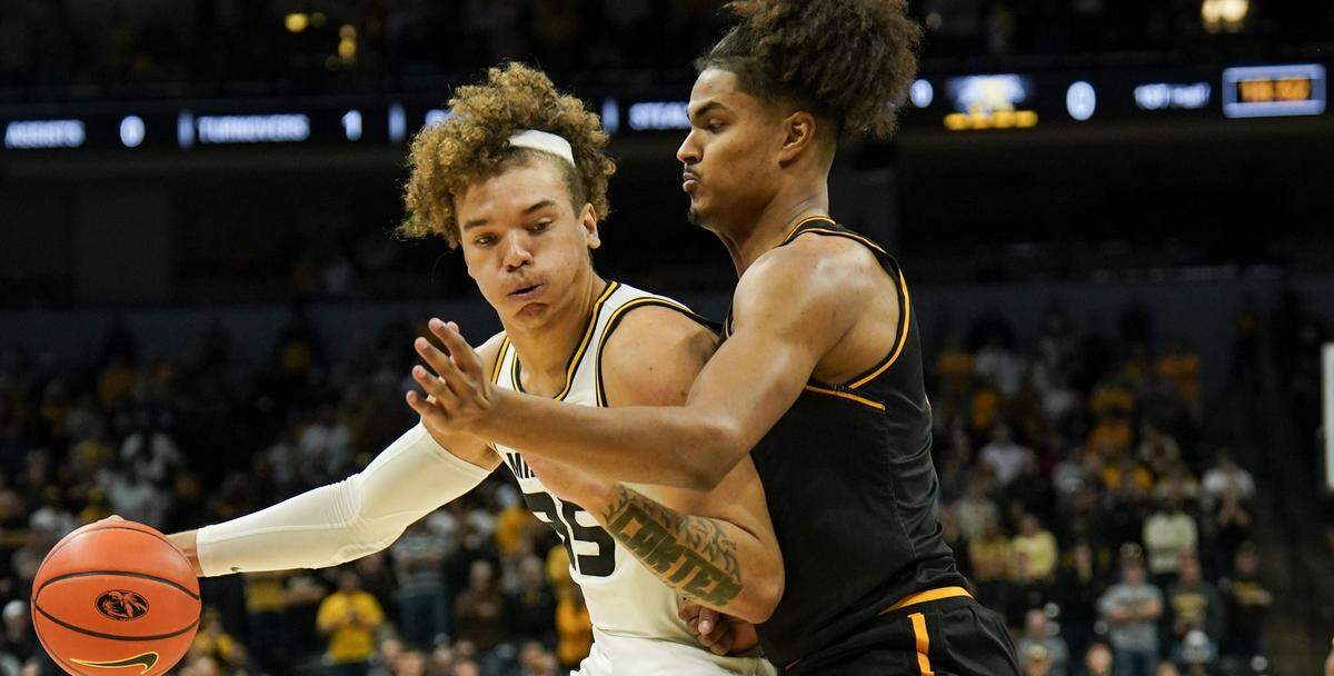 Missouri Tigers forward Noah Carter, left, is guarded by Wichita State’s Kenny Pohto during Sunday afternoon’s game at Mizzou Arena in Columbia.