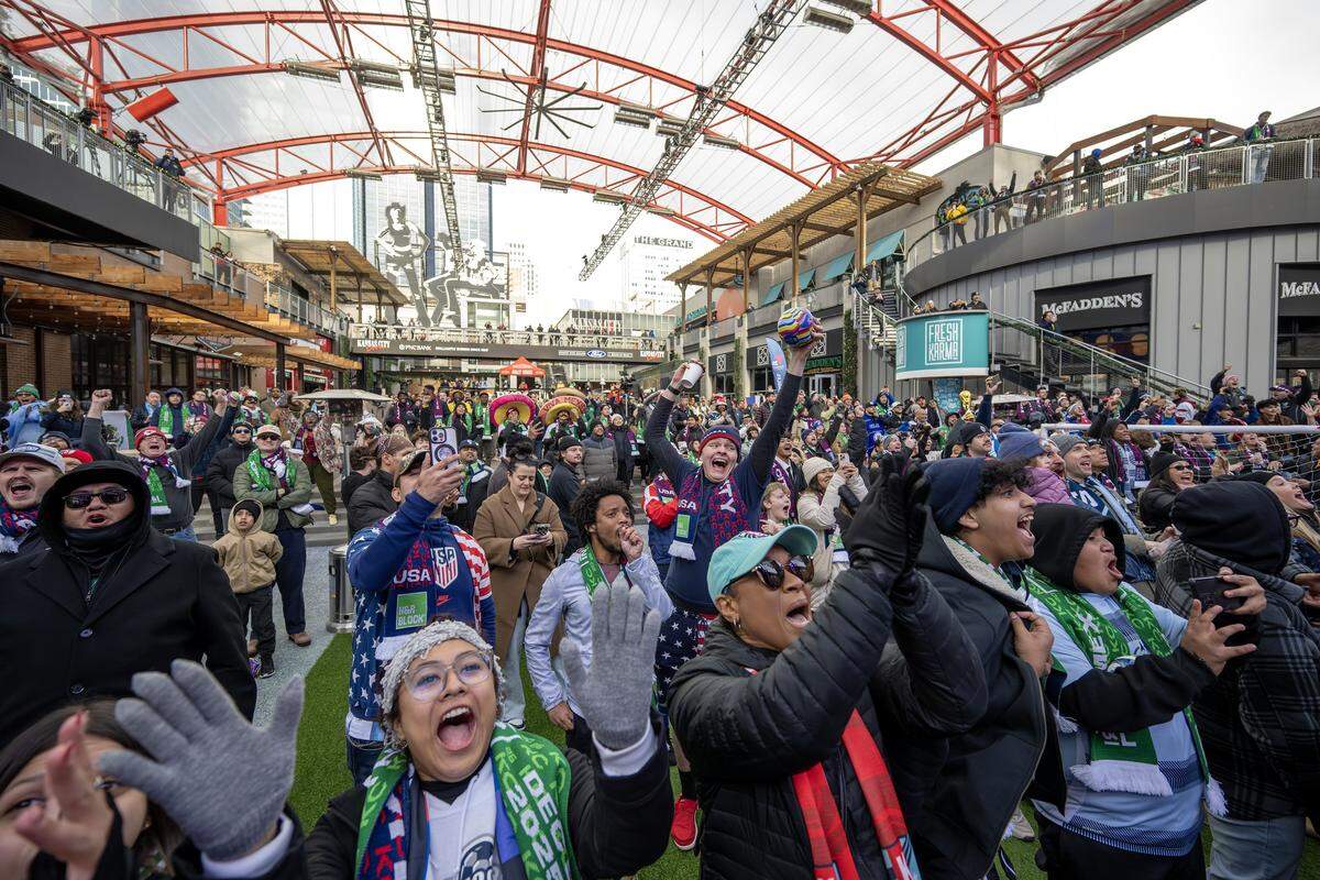 Fans cheer as the teams for Group D of the FIFA World Cup are announced during a watch party at the Power & Light District on Friday, Dec. 5, 2025, in Kansas City.
