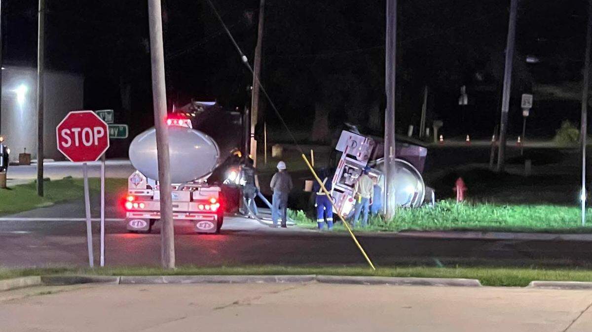 A semi truck overturned on Southwest 15th Street in Oak Grove Saturday. It took crews hours to clear the road and people were urged to evacuate the area.