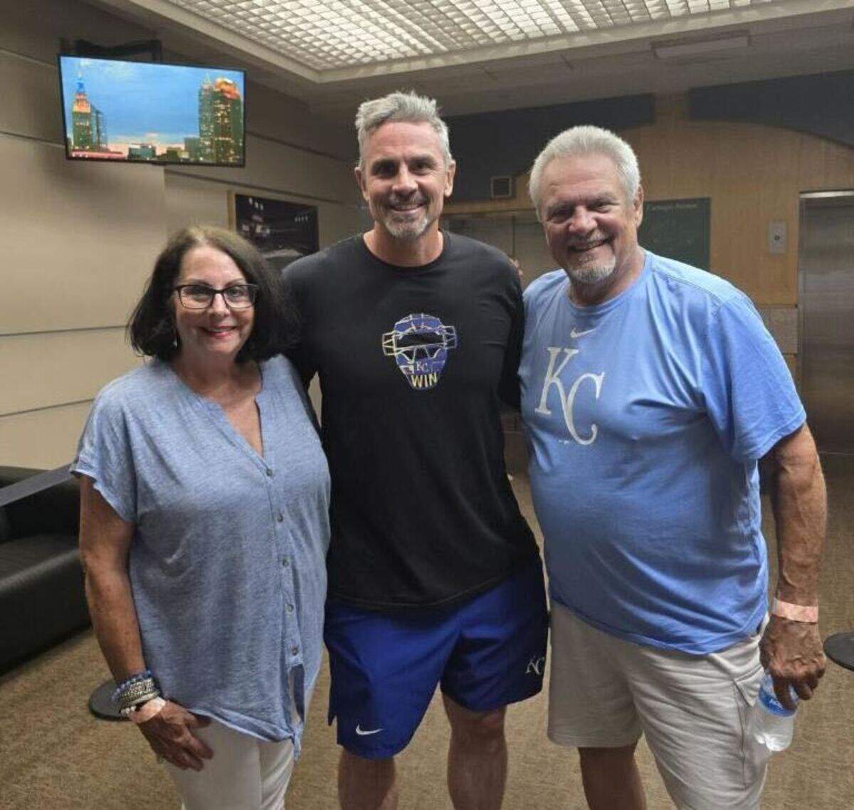 Royals bench coach Paul Hoover (middle), joined by parents Paula and Monte Sr.