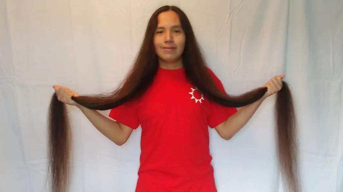 Reuben Looks Twice Jr. set the Guinness World Record for longest hair on a male teenager.