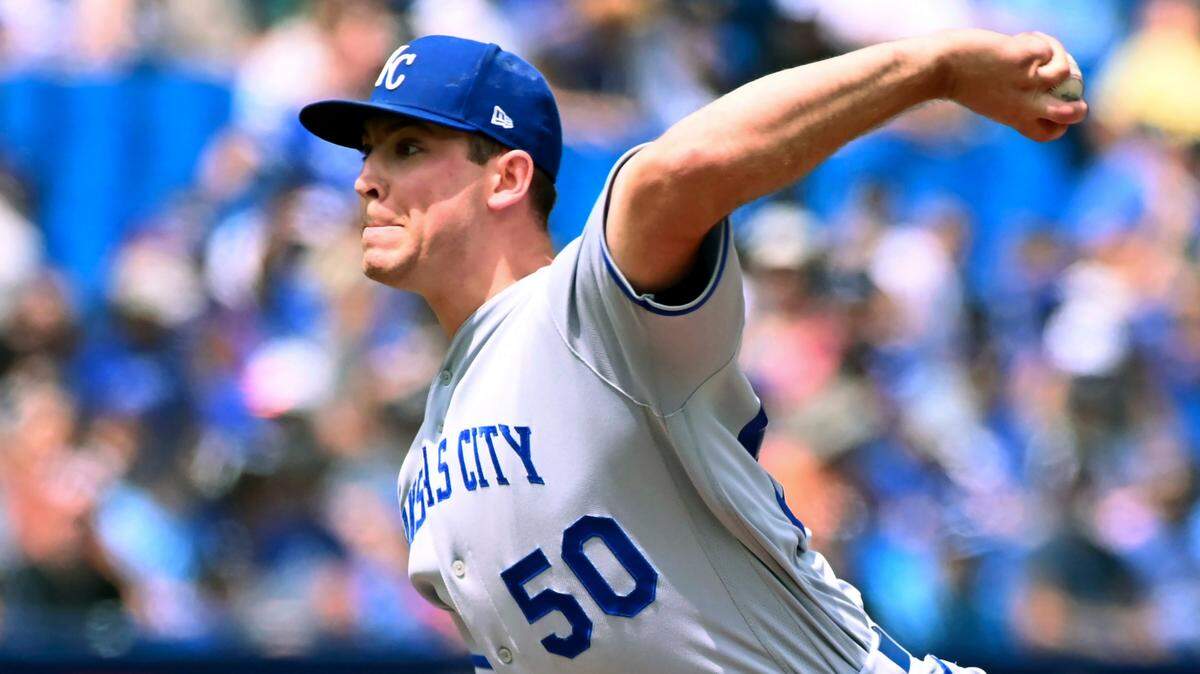 Kansas City Royals starting pitcher Kris Bubic throws to a Toronto Blue Jays batter in the first inning of a baseball game in Toronto, Sunday, July 17, 2022. (Jon Blacker/The Canadian Press via AP)