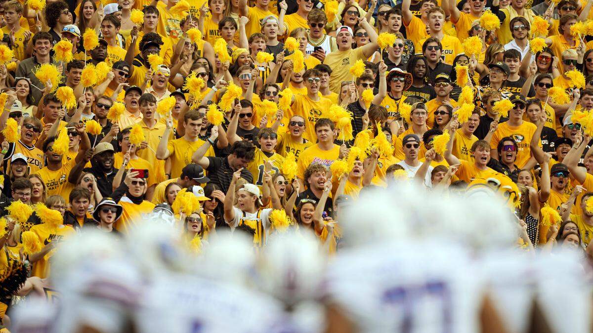 Sep 6, 2025; Columbia, Missouri, USA; Missouri Tigers fans cheer during the first half against the Kansas Jayhawks at Faurot Field at Memorial Stadium. Mandatory Credit: Jay Biggerstaff-Imagn Images