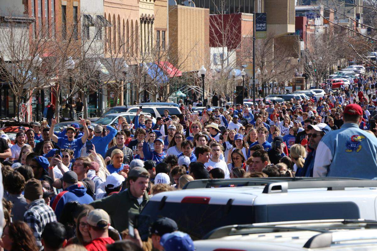 University of Kansas students and Jayhawk fans packed Massachusetts Street in downtown Lawrence Sunday to celebrate after the KU men’s basketball team earned a spot in the Final Four by defeating the University of Miami.