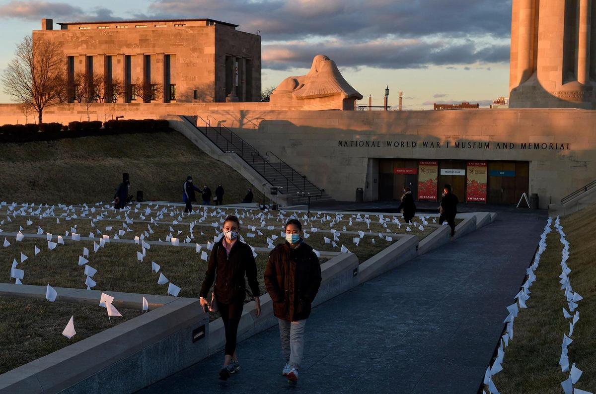 People who lost their lives to COVID-19 were remembered and frontline workers were honored on the National Day of Remembrance Tuesday, Jan. 19, 2021. A white flag for each of the 1,665 people who died of COVID in the Kansas City metro area was planted in front of the National World War I Museum and Memorial and the city skyline was lit in amber. This coincided with ceremonies across the country.