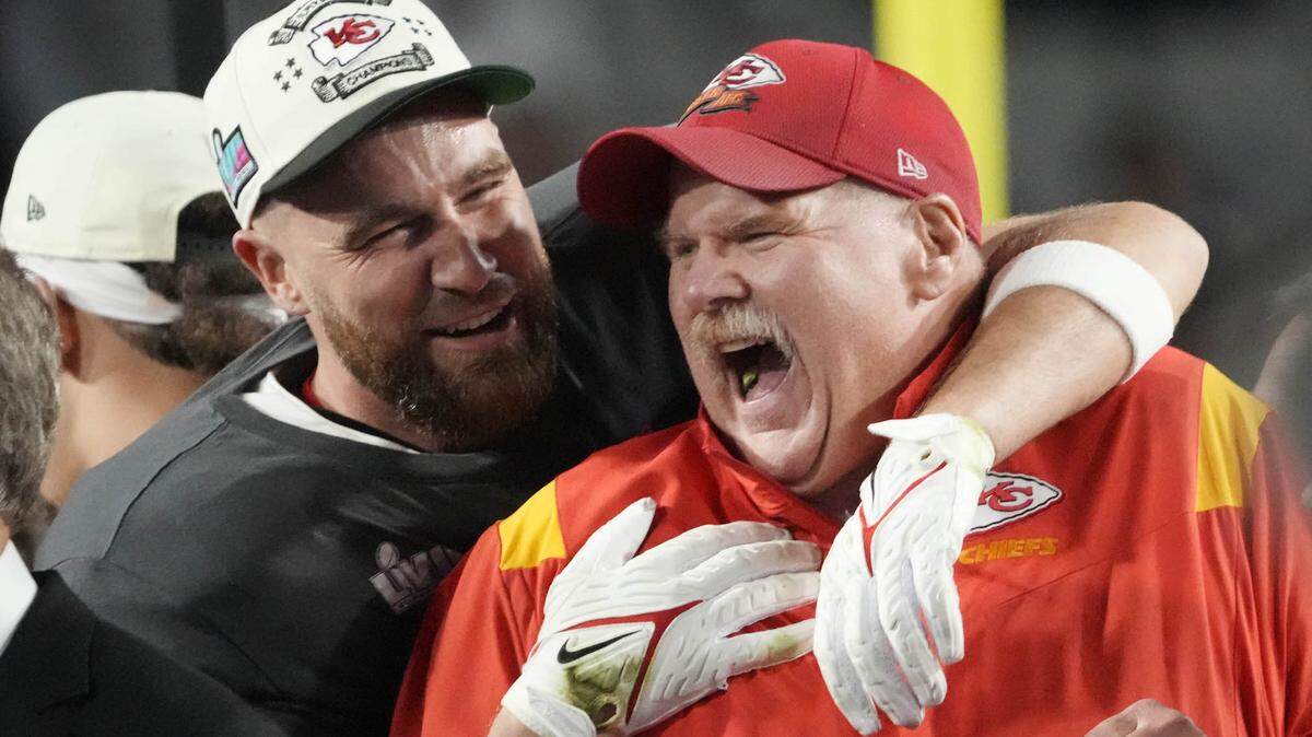 Chiefs head coach Andy Reid celebrates with tight end Travis Kelce after Super Bowl LVII.