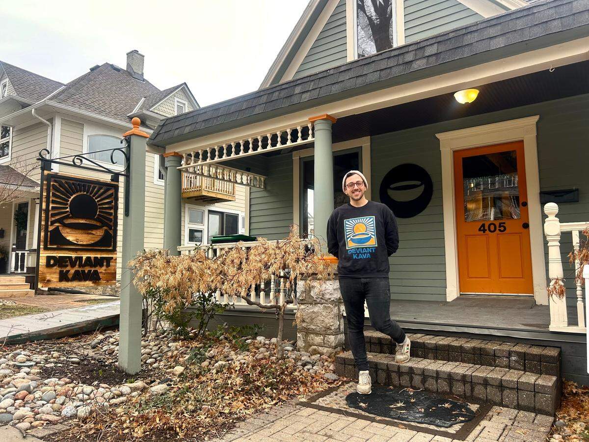 Wes Straight, one of the partners for Deviant Kava, stands outside the historic Parkville home where his business will open later this month.