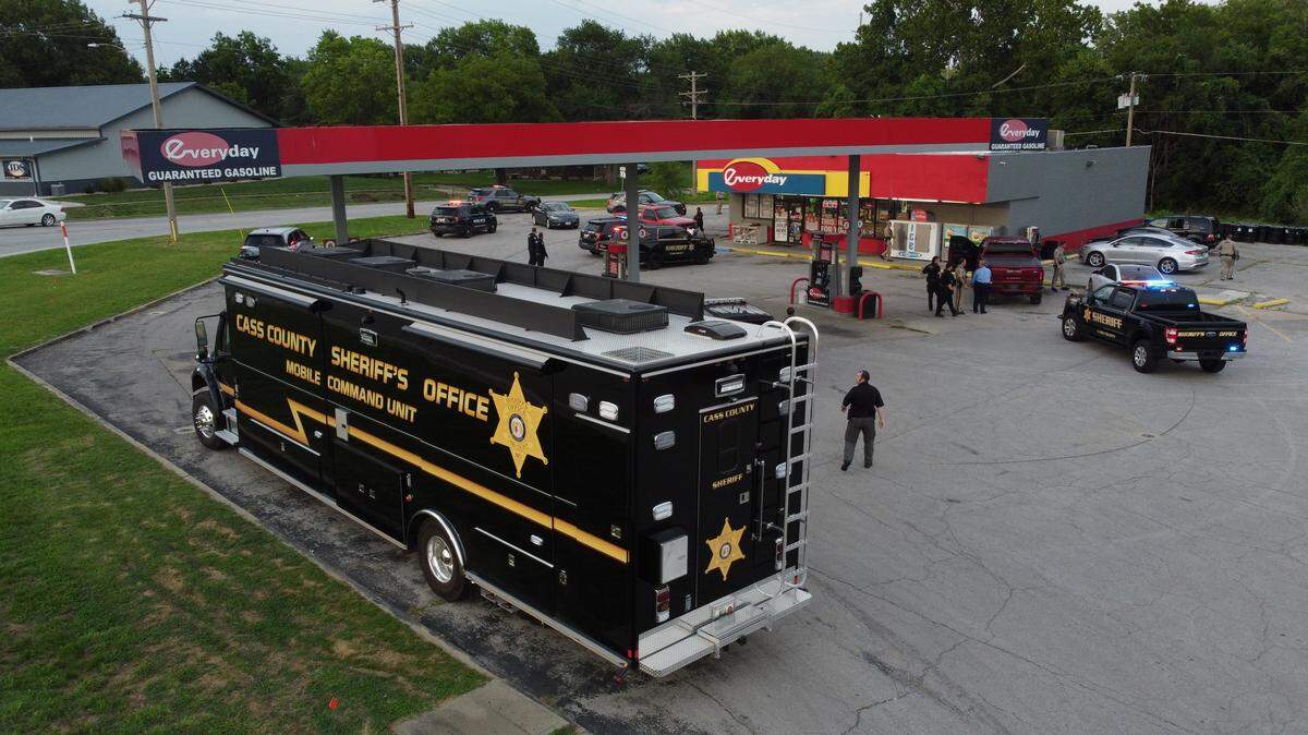 Authorities in Cass County were serving a search warrant as part of an investigation into narcotics and illegal gaming machines at Harrisonville gas station Tuesday night.