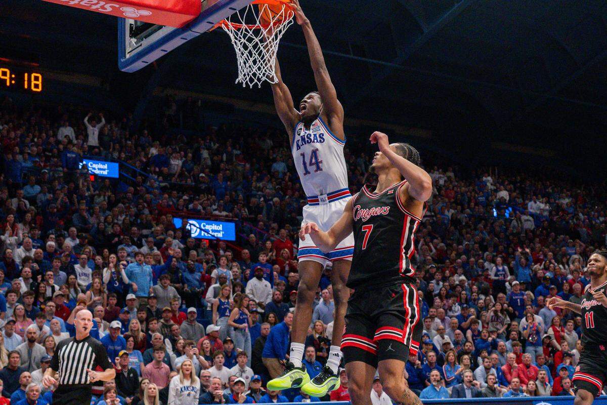 Kansas Jayhawks guard Melvin Council Jr. (14) dunks the ball in the second half of the Jayhawks game vs. the Houston Cougars on Monday, February 23, 2026, at Allen Fieldhouse.