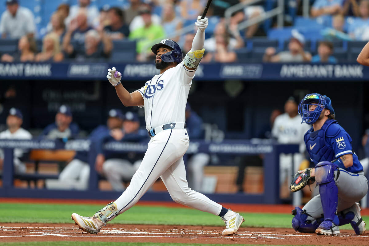 Tampa Bay Rays third baseman Junior Caminero and Kansas City Royals rookie catcher Carter Jensen watch the flight of Caminero’s first-inning home run at Tropicana Field in St. Petersburg, Florida on Thursday, June 25, 2026.