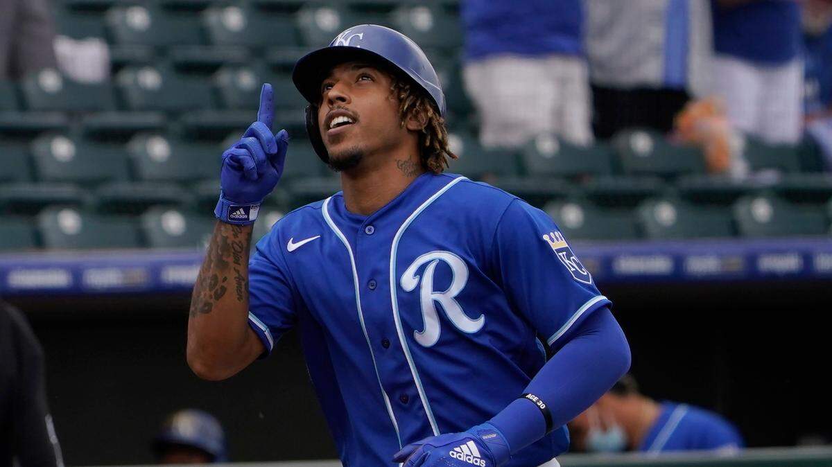 Kansas City Royals’ Adalberto Mondesi gestures as he runs to home plate after hitting a home run in the first inning of a spring training baseball game Thursday, March 25, 2021, in Surprise, Ariz. (AP Photo/Sue Ogrocki)