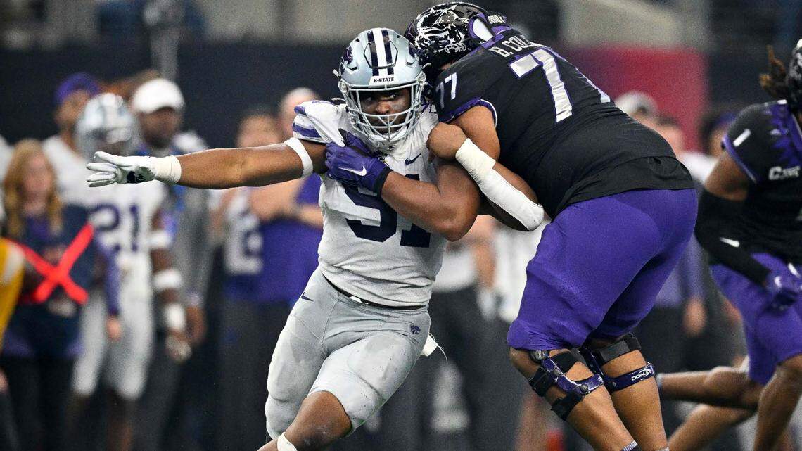 Kansas State Wildcats defensive end Felix Anudike-Uzomah works to elude TCU tackle Brandon Coleman during a game last season.