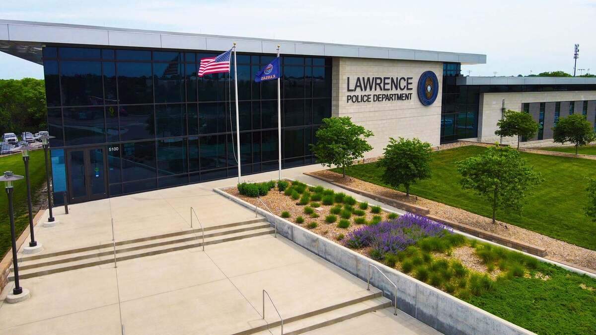 Three police officers in Lawrence, Kansas escaped injury late Thursday night when a car hit one of their cruisers on Interstate 70.
