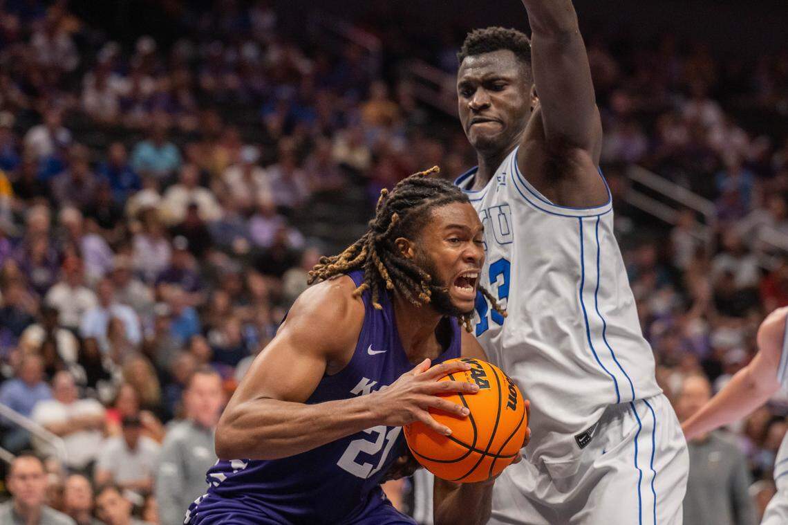 Kansas State Wildcats forward Khamari McGriff (21) tries to gain post position against BYU Cougars center Keba Keita (13) in the first half of the Wildcats first round game vs. the BYU Cougars in the Big 12 Men's Basketball Tournament, on Tuesday, March 10, 2026, at T-Mobile Center. The Wildcats lost to BYU, 105-91.