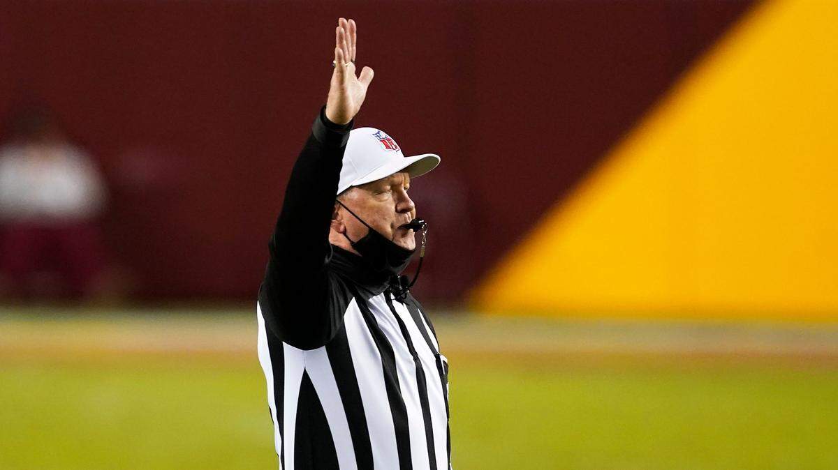 Referee Carl Cheffers signals ready for play during an NFL football game between the Carolina Panthers and the Washington Football Team, Sunday, Dec. 27, 2020, in Landover, Md. (AP Photo/Mark Tenally)