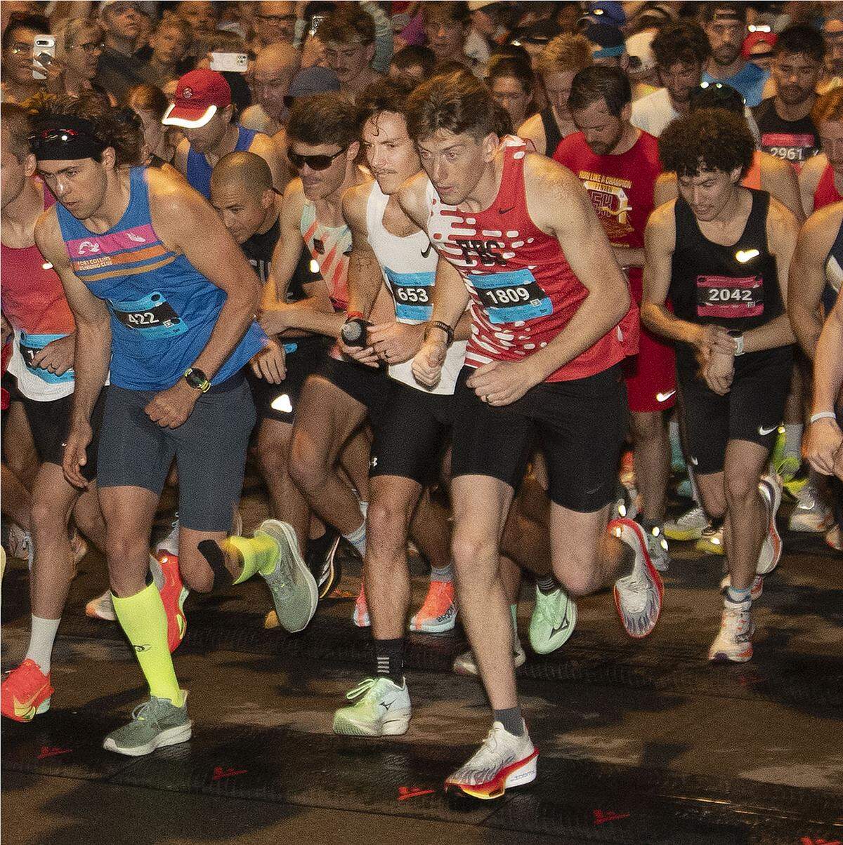 Eventual men’s and overall winner Bryce Merriman (pictured at center-left, wearing bib No. 653) takes off from the starting line at the Garmin Kansas City Marathon on Saturday, Oct. 18, 2025, in Kansas City.