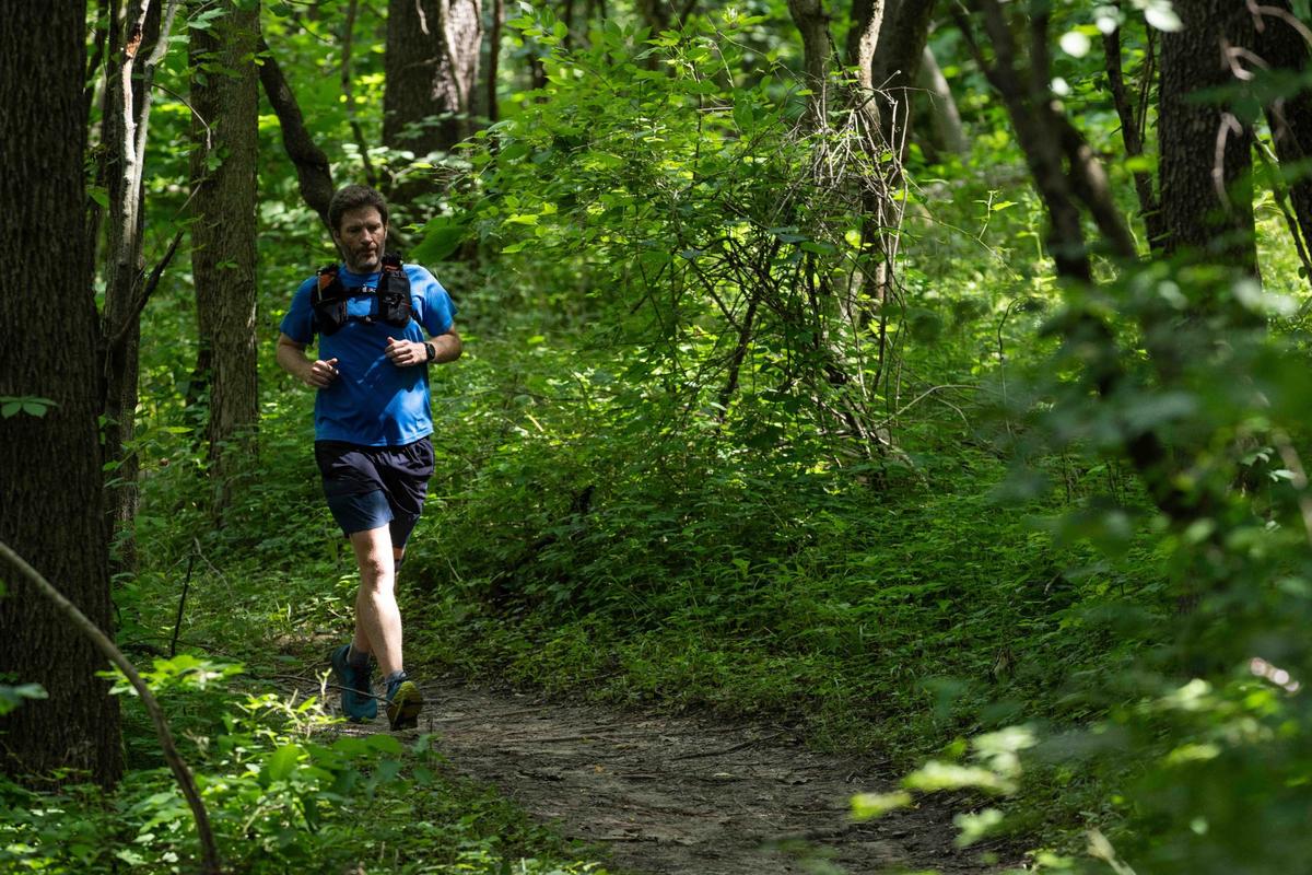 A man jogs on Hidden Valley Trail in Kansas City. Its trail names are inspired by Dorito flavors.