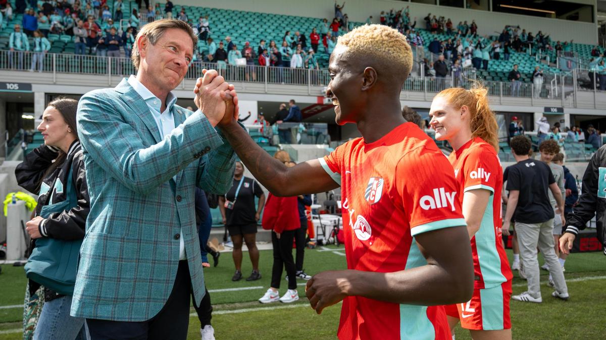 Kansas City Current co-owner Chris Long greets forward Temwa Chawinga (6) after the Current defeated the Portland Thorns 5-4 in the home opener at the new CPKC Stadium on Saturday, March 16, 2024, in Kansas City.