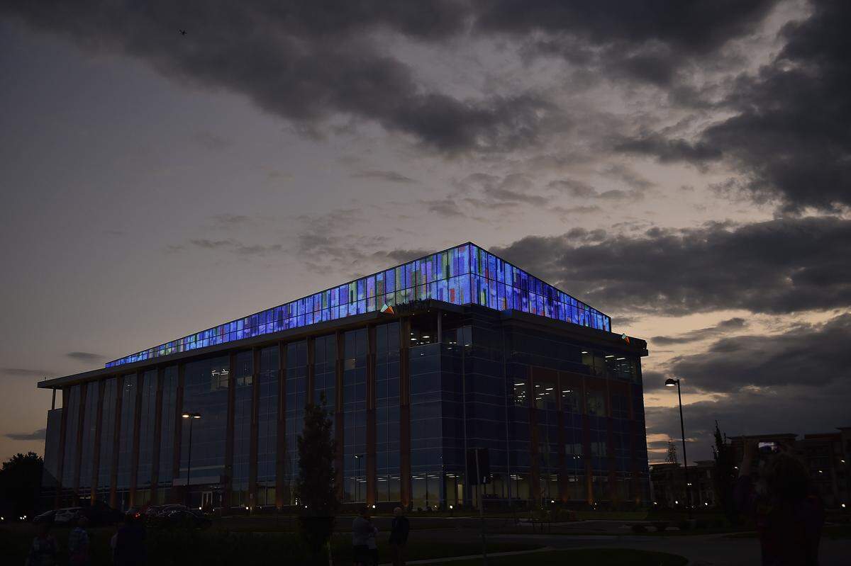 Block Real Estate Services demonstrated a digital board at CityPlace in Overland Park featuring the animation of a painting by local artist Jeff Hanson. The developer is asking the city to approve an ordinance to allow it to be lit full time.